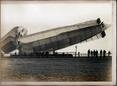 Cdr Oliver Schwann RNAS Album; dragging Mayfly back into shed after breaking in August 1911.